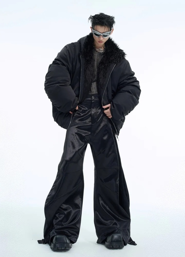 HI-LANDER model in a black puffer jacket and wide satin trousers