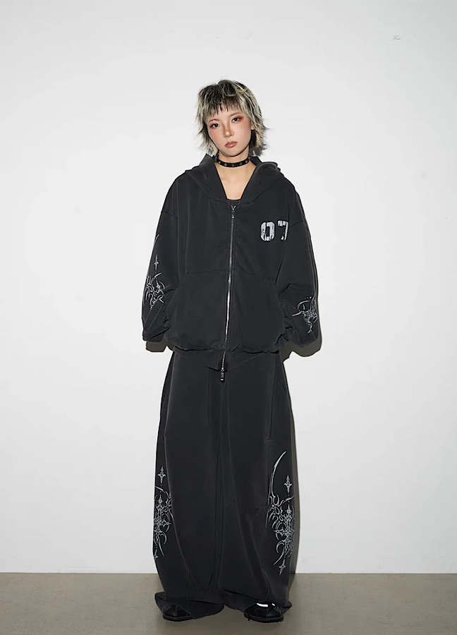 HI-LANDER model in a black printed hoodie and wide trousers